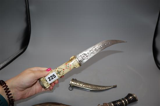 A kukri and an Eastern bone handled dagger